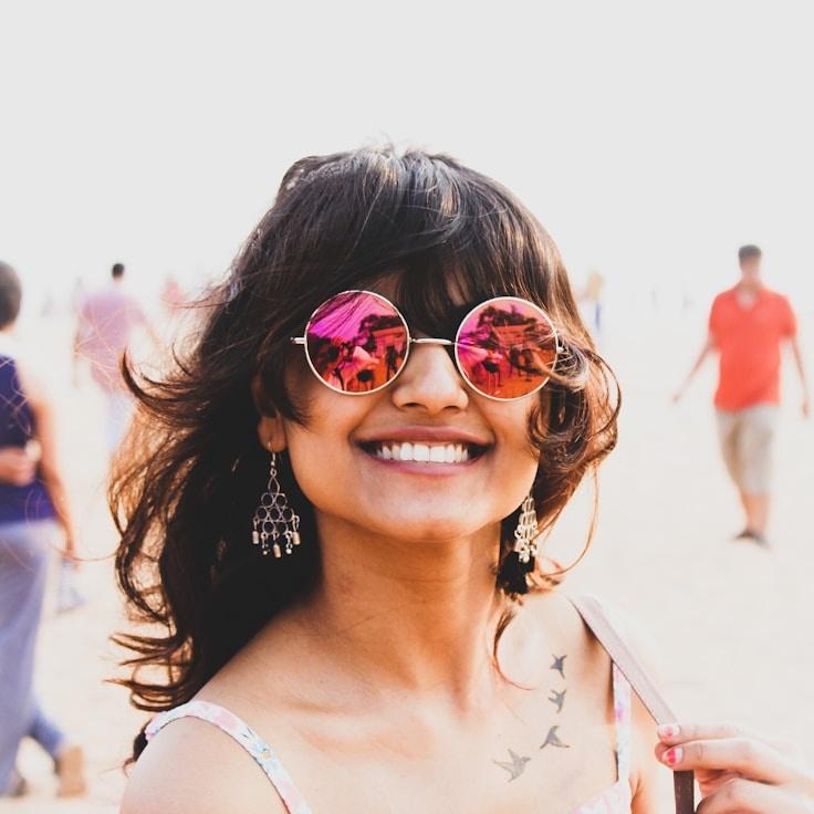 Kaveri Mehta, Lead Design Curator at ElmWoodNet, reviewing corporate floral arrangements